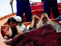 Ngư dn Việt Nam bị Trung Quốc bắt giữ(Ảnh : DR)